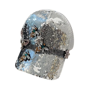 Sparkling silver sequin baseball cap with colorful rhinestone bee decorations for women