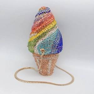 Macro detail of rainbow crystal ice cream clutch bag with gold metal chain link