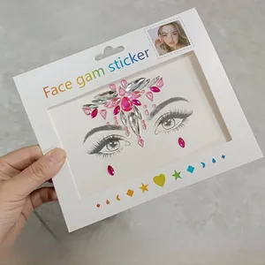 Detailed view of pink and silver face gem stickers for music festivals and parties