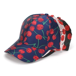 Detailed close-up of three baseball caps with cherry embroidery in navy, pink and black