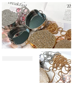 Detail of heart-shaped rhinestone mini bags with mirrors in gold and silver finish