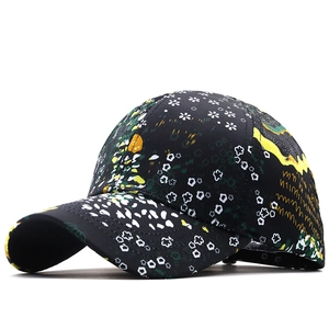 Floral print baseball cap with black base, white flower patterns and yellow curved brim