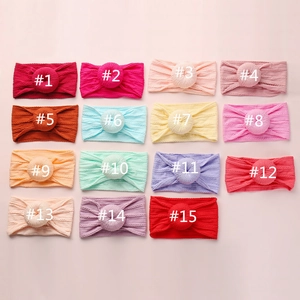 Detailed grid of soft jacquard nylon baby headbands in 15 different vibrant colors