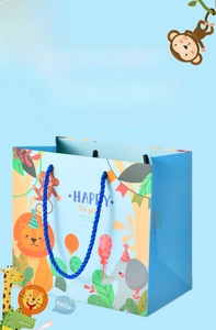 Close-up of cute cartoon animal gift bag with blue rope handles and reinforced paper