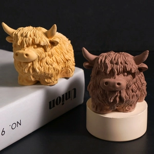 Detail of DIY highland cow candle molds showing realistic thick fur texture and resin craft