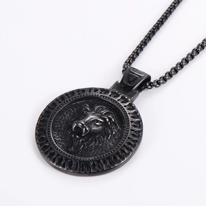 Detail of black lion head pendant with flame pattern and box chain necklace