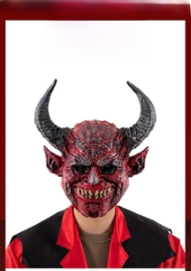 Close-up of red demon mask with realistic muscle texture and black satanic horns