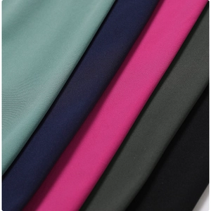 Macro detail of high-density elastic yoga shorts fabric in five matte colors