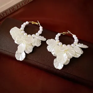 Elegant French style pearl flower hoop earrings with golden metal and white petals