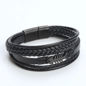 Detail of multi-layer black braided leather bracelet with fish bone magnetic clasp