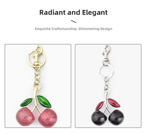 Sparkling cherry keychains with green enamel leaves and glitter finish for bags and cars