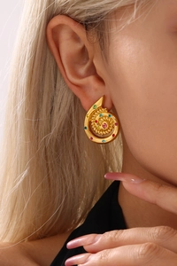 Macro shot of 18k gold plated spiral stud earrings with colorful zircon stones on model