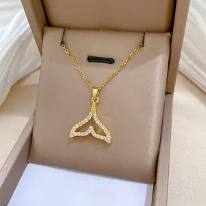Gold fishtail necklace with sparkling cubic zirconia in a premium gift box display