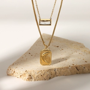 Double layered gold stainless steel necklace with sun moon pendant and crystal charm