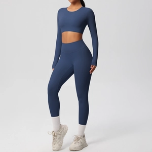 Detail view of seamless dark blue long-sleeve crop top and high waist yoga leggings set
