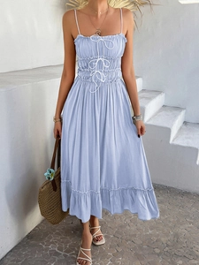 Detail of light blue A-line sun dress with ruched bodice and delicate lace-up chest ties