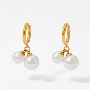 Elegant gold hoop earrings featuring double white pearl drops for a sophisticated fashion look