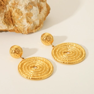 Minimalist spiral twist gold earrings for women with a textured hammered finish on metal