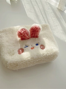 Cute bunny plush storage bag with pink ears and embroidered eyes on white background