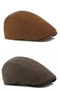 Close-up of caramel and grey-brown corduroy flat caps with thick vertical textures