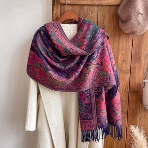 Ethnic vintage paisley shawl with fringe and colorful patterns for travel and vacation