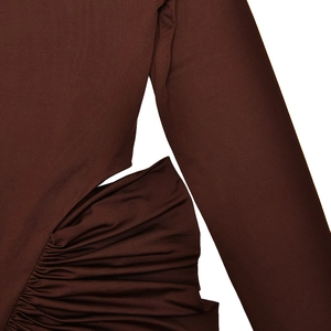 Detail view of ruching on a dark brown bodycon dress made of elastic knit fabric