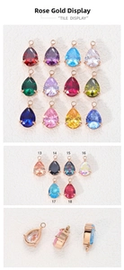 Macro view of pear-cut zircon pendants with rose gold four-prong settings and thick metal base