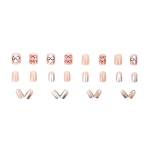 Blush peach bow press-on nails with silver glitter and vintage French design motifs