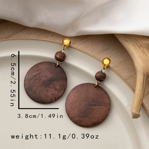 Detail view of geometric wooden earrings with size dimensions and vintage design
