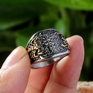 Vintage titanium steel men's ring with black gemstones and golden scorpion relief