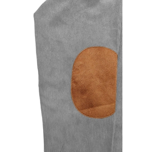 Close-up of grey corduroy polo sleeve with brown faux suede elbow patch reinforcement