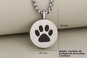 Close-up of paw print memorial pendant showing 20.1mm width and 26.4mm height dimensions