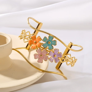 Adjustable 18k gold plated stainless steel cuff with four colorful enamel flowers