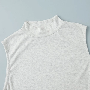 Detailed view of light gray knit fabric texture and mock neck on sleeveless summer top