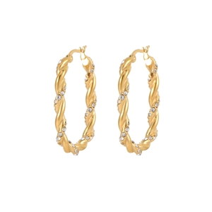 Detailed view of gold twisted hoop earrings with micro-paved white zircon stones
