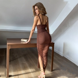Detail of a brown bodycon mesh dress featuring a deep V-neck, side slit, and ruched texture