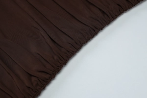Detail shot of dark brown ruched mesh fabric texture on this sexy evening dress