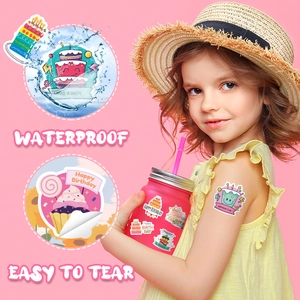 Waterproof birthday cake stickers on a pink cup showing easy-to-tear and durable features