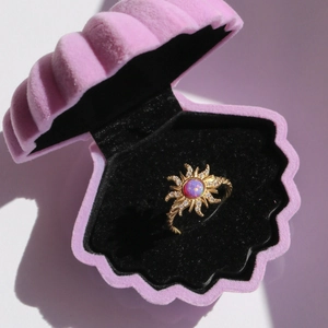 Vintage gold necklace with pink opal sunburst pendant in a pink shell velvet box