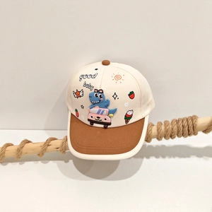 Detail of toddler baseball cap featuring 3D dinosaur patch and colorful embroidery icons