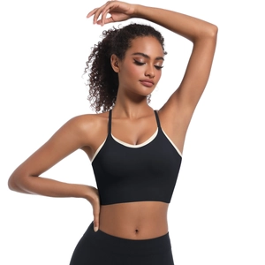 Close-up of black sports bra with cream contrast trim and thin shoulder straps