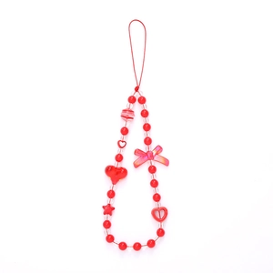 Beaded phone strap with red hearts and pink bow design on a white background