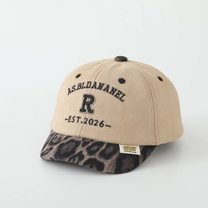 Detail of kids faux suede baseball cap with leopard print brim and letter embroidery