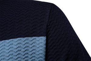 Macro shot of 3D wave knit texture on navy and light blue striped business polo shirt