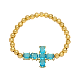 Gold beaded cross bracelet with sky blue zircon rectangular gems for women minimalist style