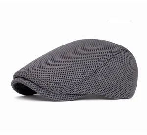 Close-up of dark gray mesh fabric ivy cap showing breathable ventilated texture