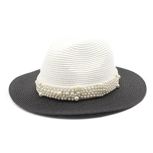 Two-tone Panama straw sun hat for women with pearl trim on white and black woven brim