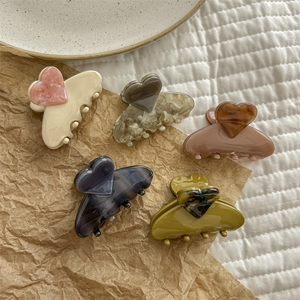 Elegant acetate heart hair claws in five marble patterns and assorted colors for women