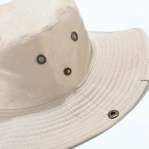 Beige wide brim outdoor sun hat with metal air vents and durable cotton fabric