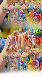 Macro view of crystal mushroom keychain with rhinestone wristlet and gold metal ring